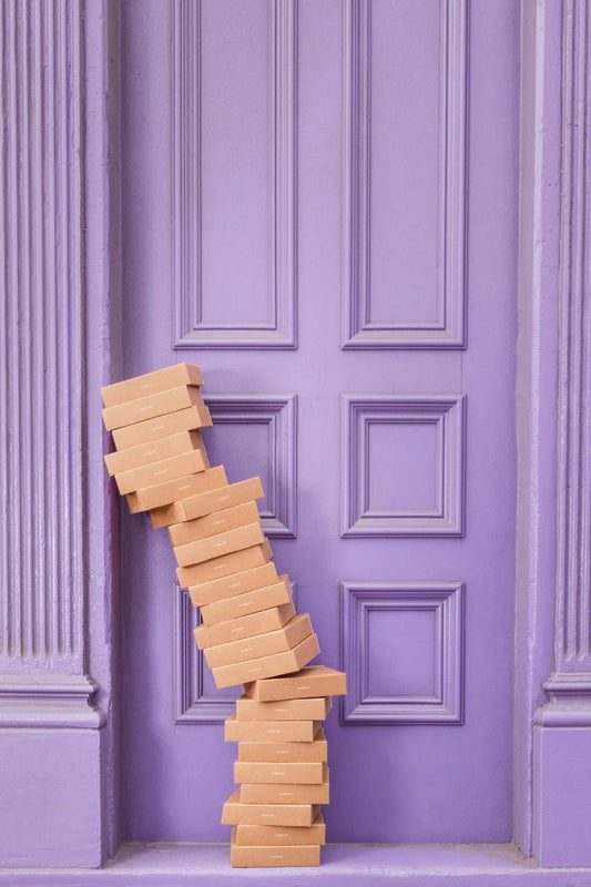 boxes piled up at purple door